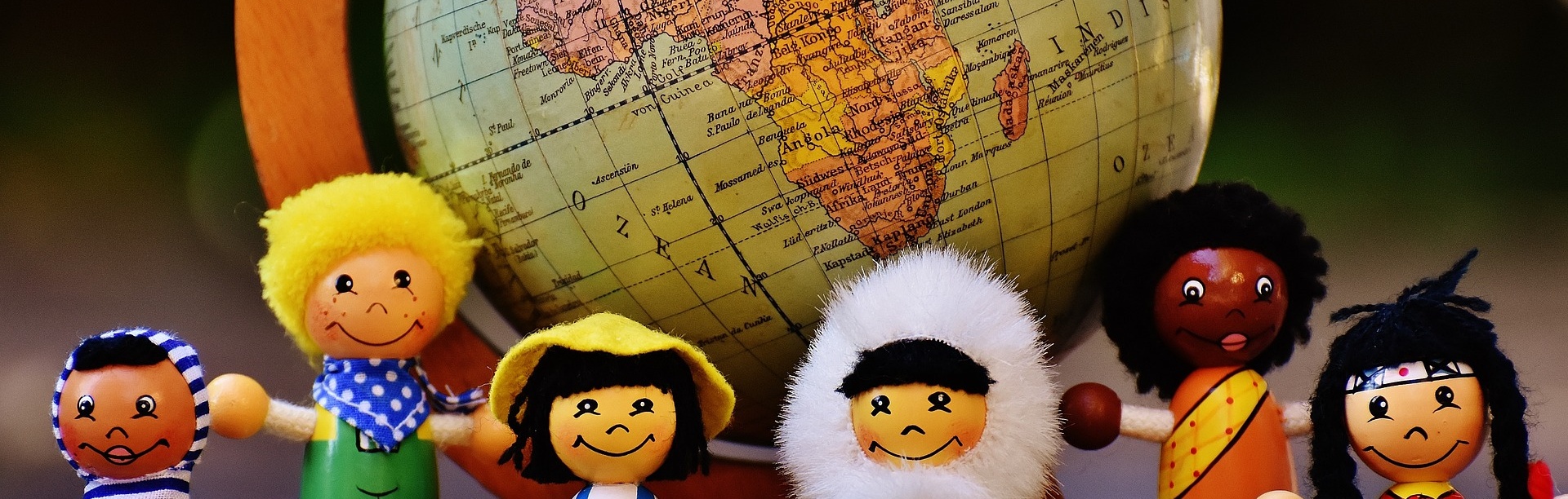 Photo of small, multi-cultural dolls standing in front of an old globe. Text reads: Recruitment and Special Populations Preparing researchers with successful recruitment strategies.