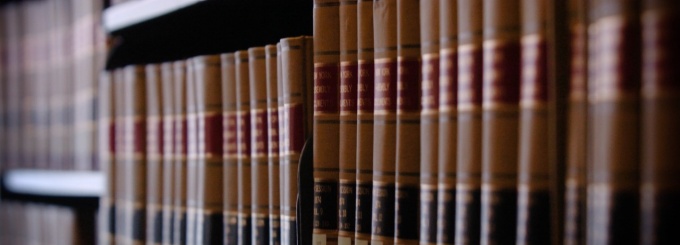 research books on a shelf.