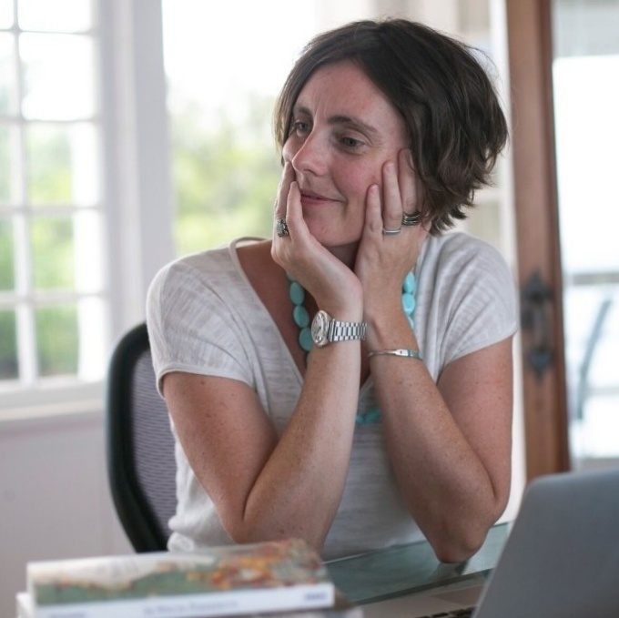 Profile image of Dr. Anderson Jane with both hands on face.