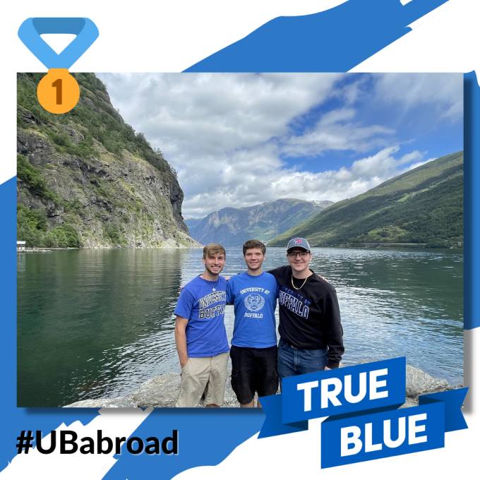 Group of Students in Front of Water/Mountain Landscape.