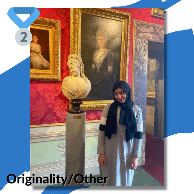 Student Standing Beside Marble Bust.