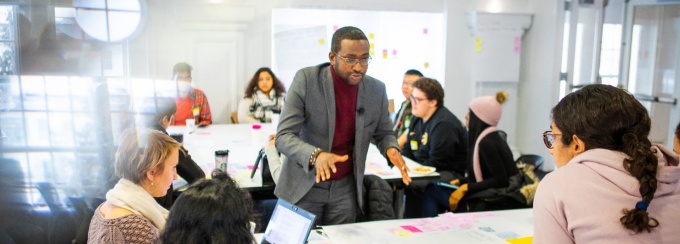 students talking at table.