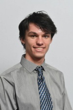 Headshot of Adam Tillou.