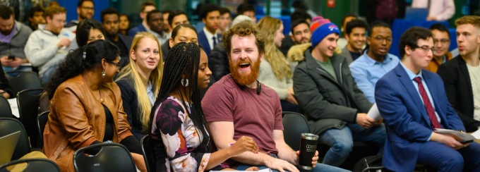 2023 Panasci team winners pose on-stage.