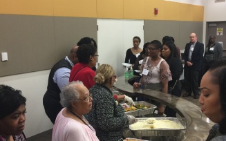 Reception Dr. Julius Adams and EOC Faculty Serving food.