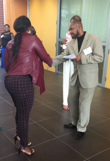 Two people shaking hands.