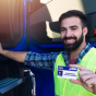 Driver in Training holding his CDL license. 
