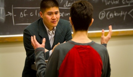 A faculty member talking to a student.