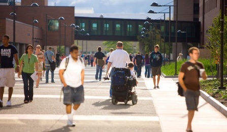 Students walking and traveling by wheelchair on the North Campus. 