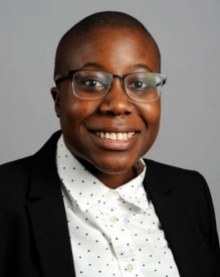 Image of a smiling Black woman wearing a black blazer. 