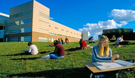 Students sketching on lawn outside Clemens Hall.