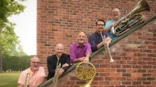 Photo of Atlantic Brass Quintet members on staircase.