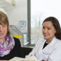 Student and instructor reviewing lab notes. 