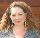 women smiling to the camera.