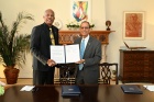 UB President Satish K. Tripathi signed a memorandum of understanding (MOU) with Sir Hilary Beckles, vice chancellor of the University of the West Indies, on May 20 at a celebratory event at the president’s home. 