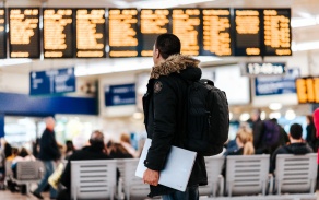 Man standing in an airport. 