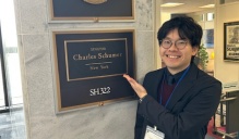 Yuya Yamamoto in front of Senator Charles Schumer's office.