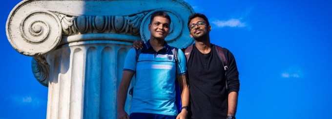 Two students smiling outside at Baird Point.