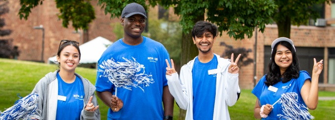 Orientation Transition and Parent Programs orientation volunteers smiling in UB blue shirts.