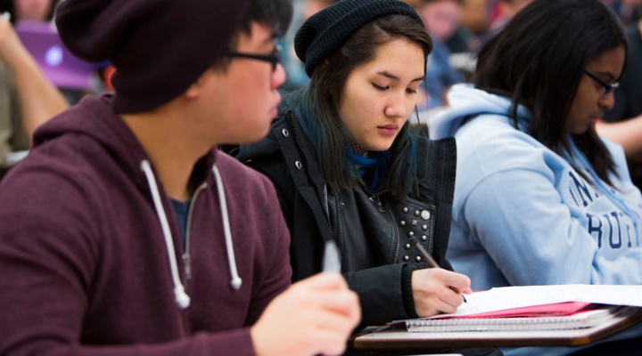 Students taking notes. 