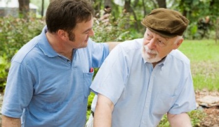 Photo of Young Man with arm on the shoulder of older man.