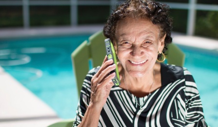 Photo of older woman on cell phone.