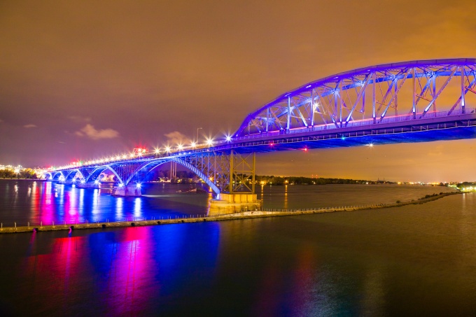 The Peace Bridge lit up at dusk.