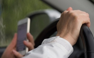 person driving while texting.