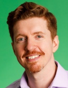 headshot of Trueman, man with red hair and facial hair.