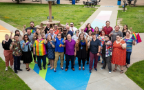 Members of the LGBTQ Faculty and Staff Association pose for a photo at Progress Pride Paths. Photo: Meredith Forrest Kulwicki. 