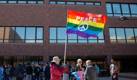 Rainbow flag on academic spine.