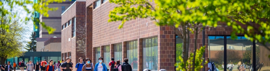 Students walking on UB's North Campus in the spring.