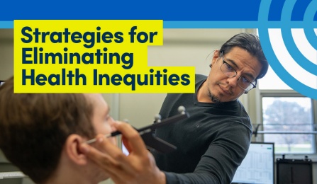 Person examining a patient in room.