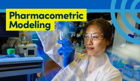 Person in lab holding a test tube.