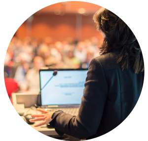 woman presenting to audience.