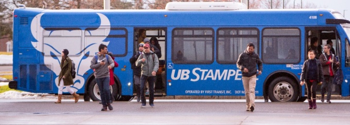 Stampede bus dropping off students on the Flint Loop on North Campus. Photographer: Meredith Forrest Kulwicki. 