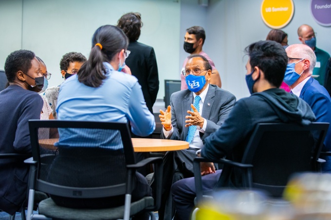 President Tripathi speaks with students.