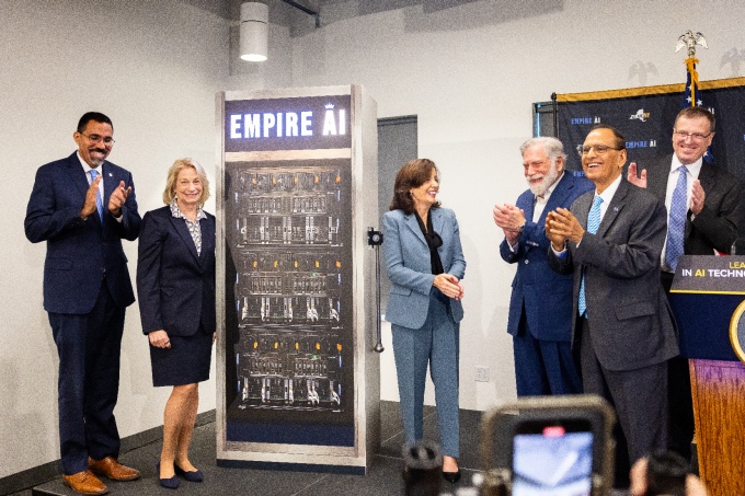 A group applauds at the launch of Empire AI.