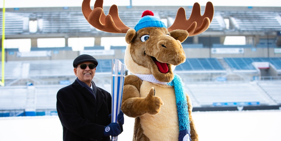 President Satish K. Tripathi with World University Games mascot Adirondack Mac. Photographer: Meredith Forrest-Kulwicki.