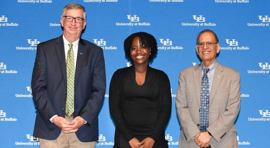 President Satish K. Tripathi and Provost A. Scott Weber pose with student awardee at the 2023 Celebration of Academic Excellence.