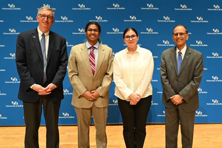 President Satish K. Tripathi and Provost A. Scott Weber pose with awardees at the 2024 Celebration of Academic Excellence. 