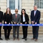 President Satish K. Tripathi and others participate in the ribbon cutting for Crosby Hall's Ceremonial Reopening. 