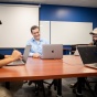 Luke Ziarek, part of the new EDJI (equity, diversity, justice and inclusion) fellows program developed by Curriculum, Assessment and Teaching Transformation to support inclusive pedagogy, photographed working with students in Fronczak Hall in December 2023. Ziarek is an assocaite professor with computer science and engineering. 