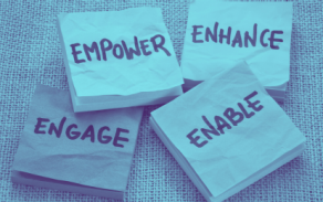 four post it notes with each saying a different word: ENGAGE, EMPOWER, ENHANCE, ENABLE. 