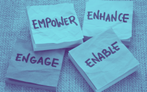 four post it notes with each saying a different word: ENGAGE, EMPOWER, ENHANCE, ENABLE.