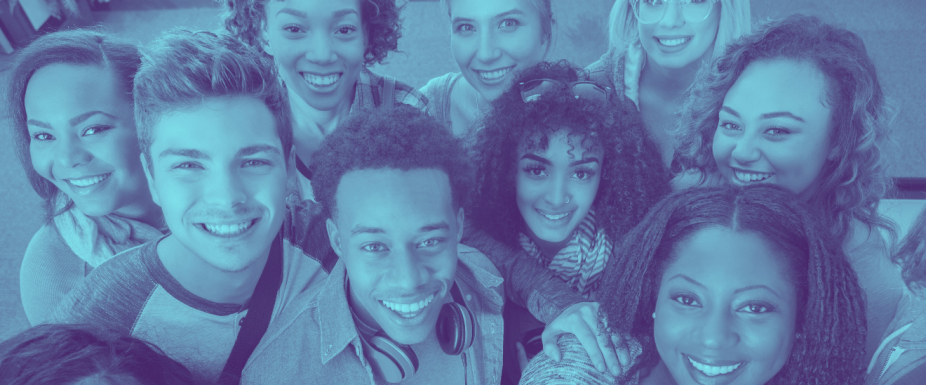 diverse group of college age students smiling at the camera.