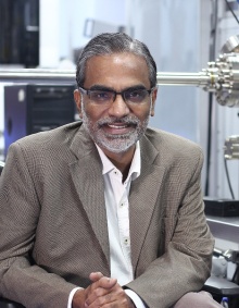 Dr. Thalappil Pradeep sitting in his lab. 