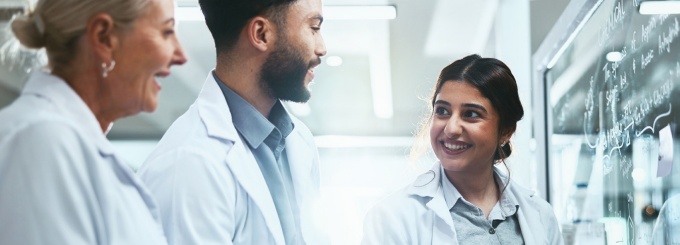 Team of lab technicians having a meeting.