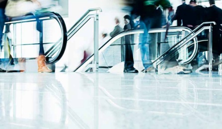 artistic photo of escalators to imply busy travel.