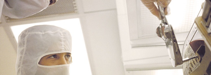 researchers in Davis Hall clean room.